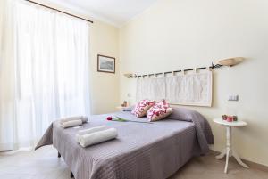 Postel nebo postele na pokoji v ubytování B&B Villamarì