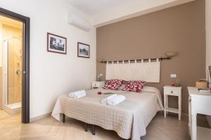Giường trong phòng chung tại B&B Villamarì