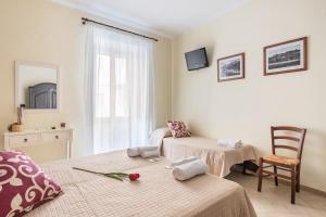 Postel nebo postele na pokoji v ubytování B&B Villamarì