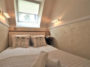 Posteľ alebo postele v izbe v ubytovaní VIP Apartamenty Cristal
