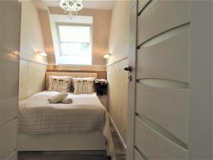 Posteľ alebo postele v izbe v ubytovaní VIP Apartamenty Cristal