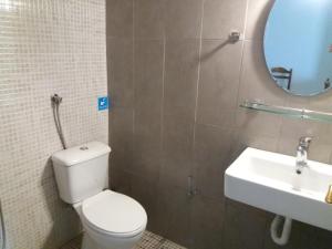 a bathroom with a toilet and a sink at Amazon Studios in Agia Marina Nea Kydonias