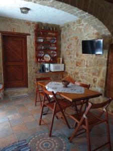 A kitchen or kitchenette at Rosalia Apartments