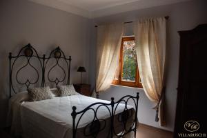 Postel nebo postele na pokoji v ubytování Villa Buschi