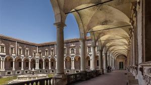 a building with columns and arches in a courtyard at Giupy Home in Catania