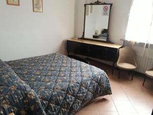 Letto o letti in una camera di B&B L'uva Fragolina