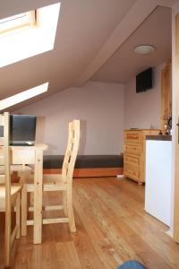 Μια τηλεόραση ή/και κέντρο ψυχαγωγίας στο Apartament Rodzinny