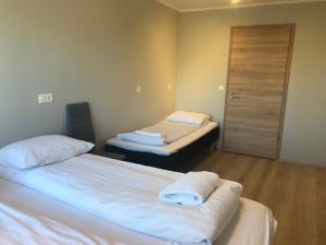 Ένα ή περισσότερα κρεβάτια σε δωμάτιο στο Guesthouse Skógafoss