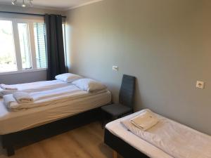 En eller flere senger på et rom på Guesthouse Skógafoss