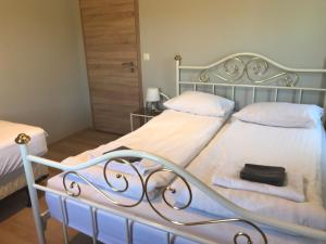 Ένα ή περισσότερα κρεβάτια σε δωμάτιο στο Guesthouse Skógafoss