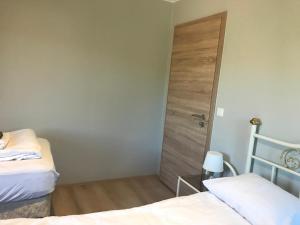 Ένα ή περισσότερα κρεβάτια σε δωμάτιο στο Guesthouse Skógafoss