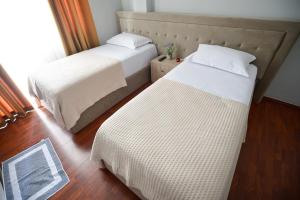 
A bed or beds in a room at Hotel Niku
