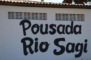 a sign for a puerto rican rib sauce restaurant at Pousada Rio Sagi in Baía Formosa