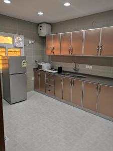 Kuchyň nebo kuchyňský kout v ubytování Alwan apartment hotel