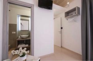 TV a/nebo společenská místnost v ubytování Imera B&B