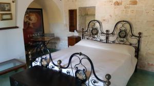 מיטה או מיטות בחדר ב-Casa alle vigne