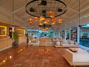 a lobby of a hotel with couches and a pool at Meliá Punta Cana Beach Wellness Inclusive - Adults only in Punta Cana