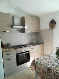 A kitchen or kitchenette at Alloggio Turistico Civico 4