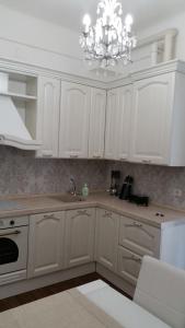 Kuchyň nebo kuchyňský kout v ubytování ISONZO COMFORT APARTAMENT