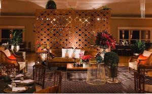 a living room with a couch and a table at La Dolce Villa in Avaré