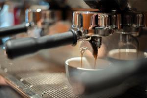 a coffee maker is making a cup of coffee at Yarra Valley Lodge in Wonga Park