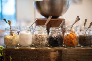 a group of jars filled with different types of food at Yarra Valley Lodge in Wonga Park