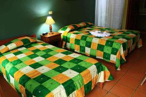 Voodi või voodid majutusasutuse Hotel Guadalupe toas