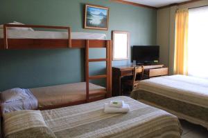 Katil dua tingkat atau katil-katil dua tingkat dalam bilik di Hotel Guadalupe