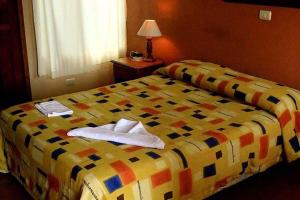 Voodi või voodid majutusasutuse Hotel Guadalupe toas