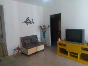 Телевизор и/или развлекательный центр в Casa em Cabo Frio