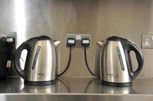 two coffee pots are hooked up to a phone at The Hostel in Edinburgh
