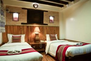 Ένα ή περισσότερα κρεβάτια σε δωμάτιο στο Nepal Pavilion Inn