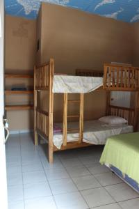 Postel nebo postele na pokoji v ubytování Las Casitas Hostal-Ataco