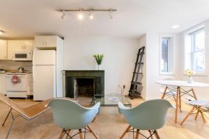 a living room with chairs and a fireplace at Big Bright 1 BR at U/Shaw + 14th on Quaint Swann in Washington