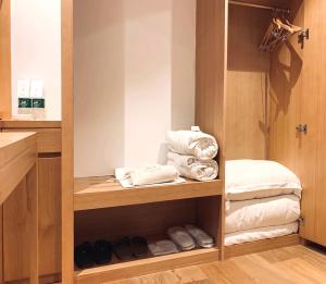 Una cama o camas en una habitación de Bai Yun Qin She Boutique