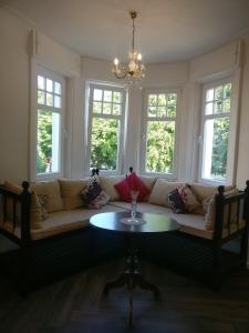 a living room with a couch and a table at Villa Wilmarie in Rottweil