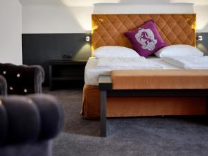 Łóżko lub łóżka w pokoju w obiekcie Hotel Villa Carlton - Adults Only