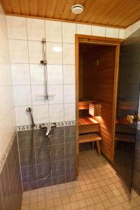 a bathroom with a shower and a sink and a toilet at Villa de pikku Maria in Hamina +18 photos