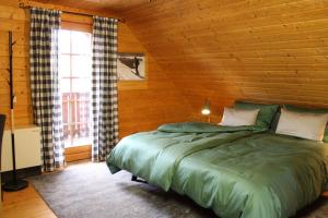 מיטה או מיטות בחדר ב-John.B lodge