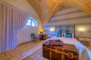 Postel nebo postele na pokoji v ubytování Masseria Sorani + 37 fotografií