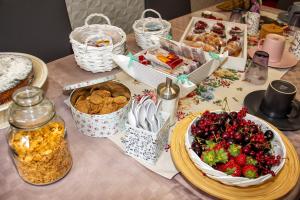 a table with food and baskets of food on it at B&B Carol in Cetara