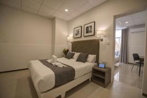 Letto o letti in una camera di Europa Hotel