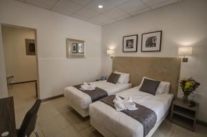 Letto o letti in una camera di Europa Hotel