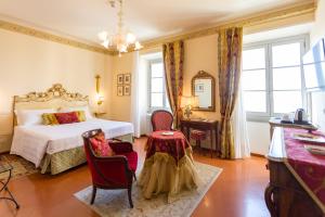 Postel nebo postele na pokoji v ubytování Hotel Villa Marsili