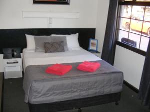 Postel nebo postele na pokoji v ubytování Motel Lodge