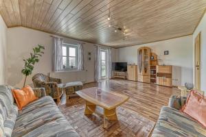 a living room with a couch and a table at Ferienwohnung Barth in Tittling