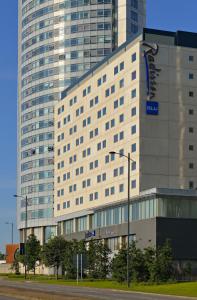 a large building with a sign on the side of it at Radisson Blu Hotel, Liverpool in Liverpool