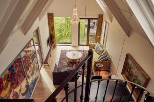 an overhead view of a hallway with a stairway at Hotel Miss Blanche in Groningen