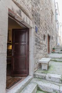 an entrance to a stone building with a wooden door at Luxury apartment Gabriela in Korčula