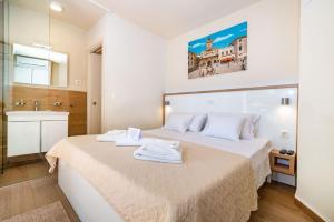 Posteľ alebo postele v izbe v ubytovaní Idassa Palace rooms